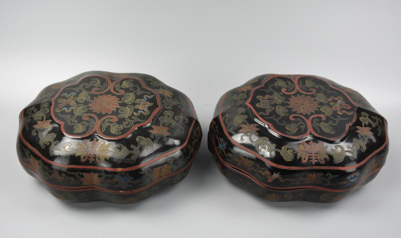 Appraisal: A set of matching lacquerware boxes with eight gently scalloped