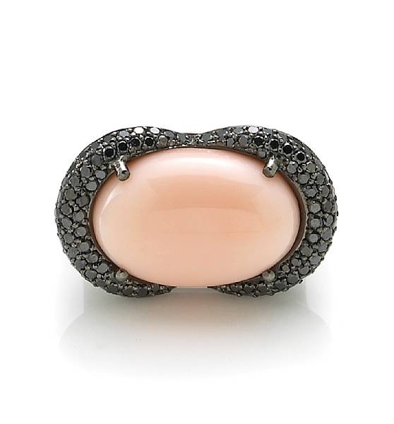 Appraisal: A coral and black diamond ring mounted in fourteen karat