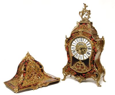 Appraisal: A reproduction faux tortoiseshell and gilt brass bracket clock with