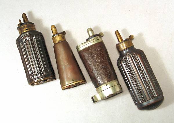 Appraisal: A lot of four th century pistol powder flasks Comprising