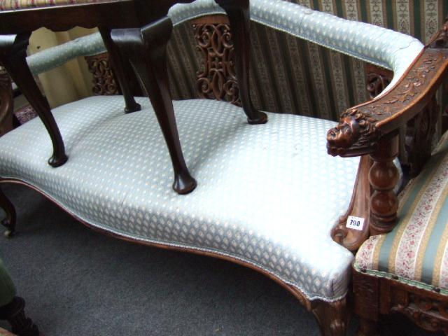 Appraisal: A Victorian rosewood framed sofa the hump crest over triple