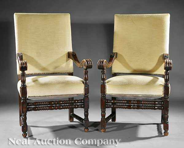 Appraisal: A Pair of Antique Louis XIV-Style Carved Mahogany Armchairs tall