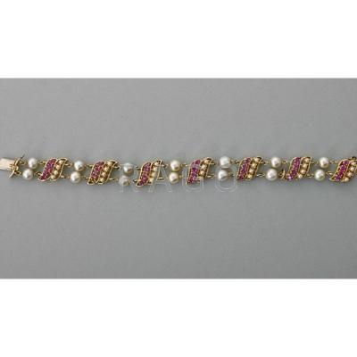 Appraisal: K GOLD PEARL AND RUBY LINK BRACELET ca Japanese cultured