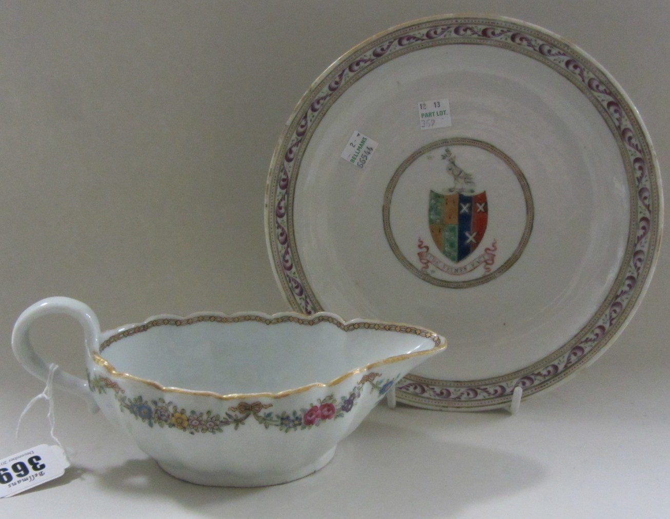 Appraisal: A Chinese export armorial sauceboat Qianlong of oval fluted form