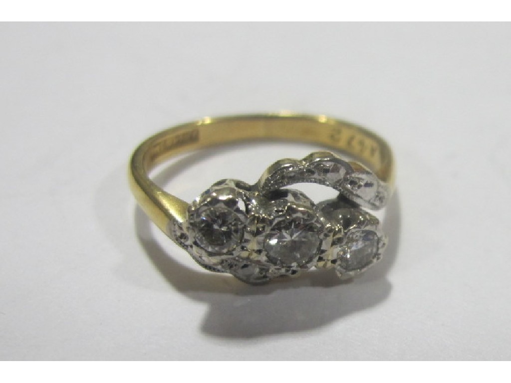 Appraisal: Nineteen thirties ct gold diamond three stone twist ring