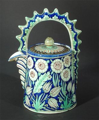 Appraisal: A Cantagalli Persian ewer and cover drum form decorated with