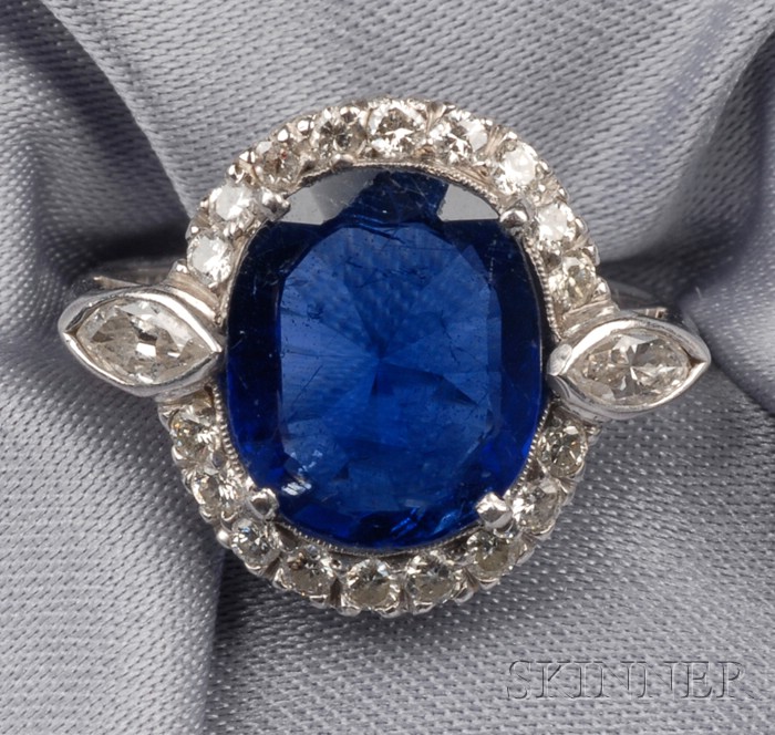 Appraisal: Platinum Sapphire and Diamond Ring prong-set with an oval-cut sapphire