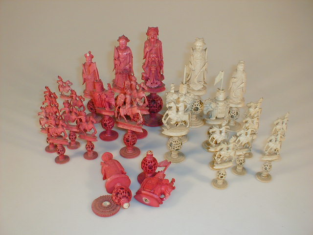 Appraisal: A thC Cantonese natural and red stained ivory figural chess