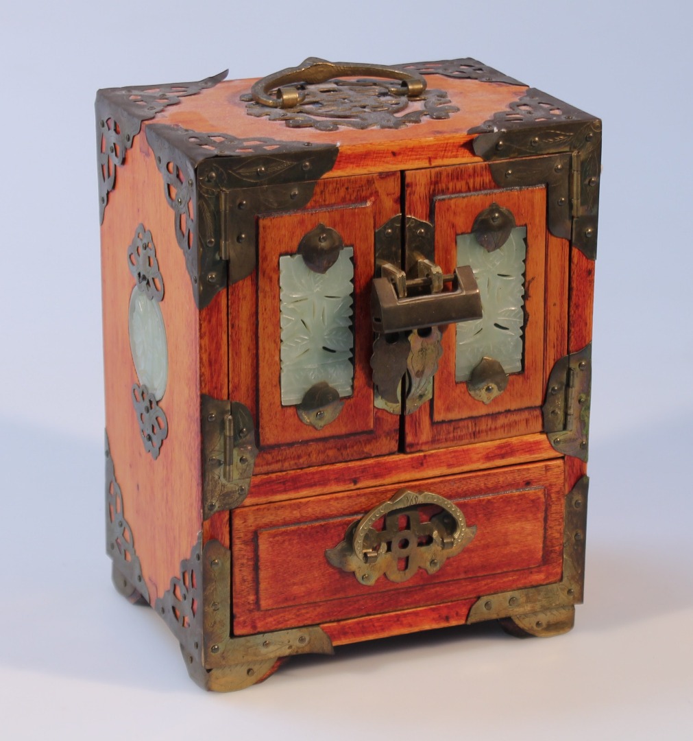 Appraisal: A thC Chinese hardwood jewellery casket with metal mounts fronted