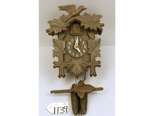 Appraisal: Small hand carved Black Forest region cuckoo clock with weights