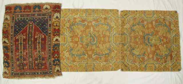 Appraisal: A pair of Oriental mats with stylised orange ground central