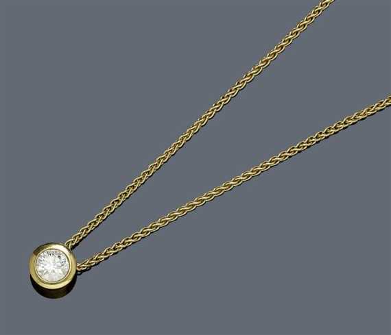 Appraisal: DIAMOND PENDANT WITH CHAIN Yellow gold Casual-elegant solitaire model with