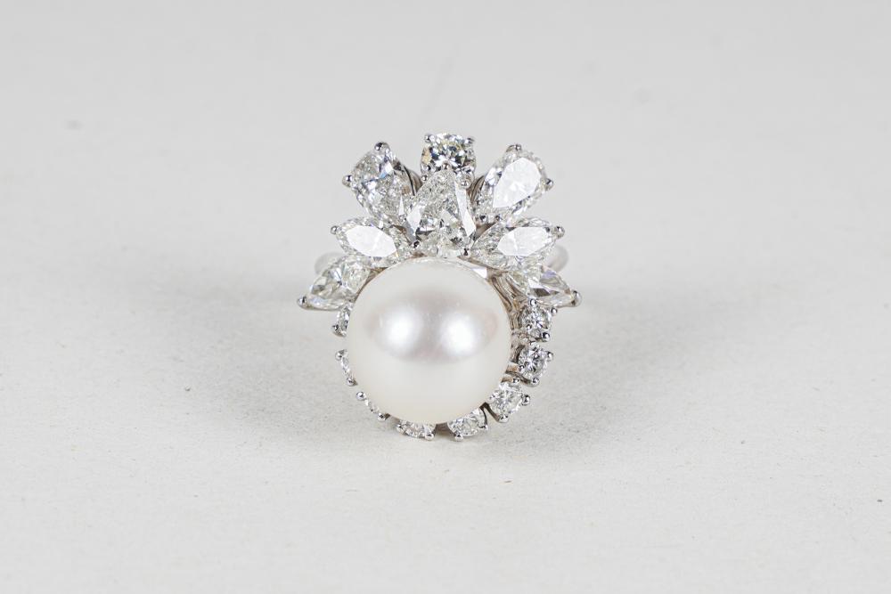 Appraisal: PLATINUM DIAMOND CULTURED PEARL RINGcontaining one oval cultured pearl measuring