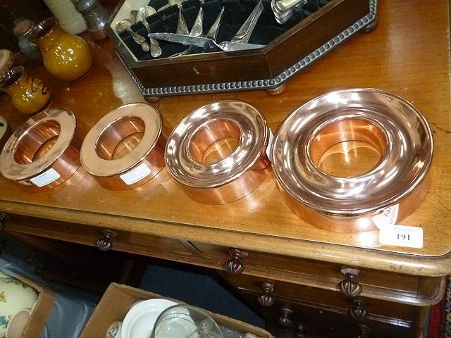 Appraisal: FOUR VARIOUS COPPER JELLY MOULDS of ring form the largest