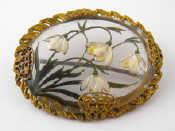 Appraisal: A gilt framed brooch the reverse intaglio engraved and painted