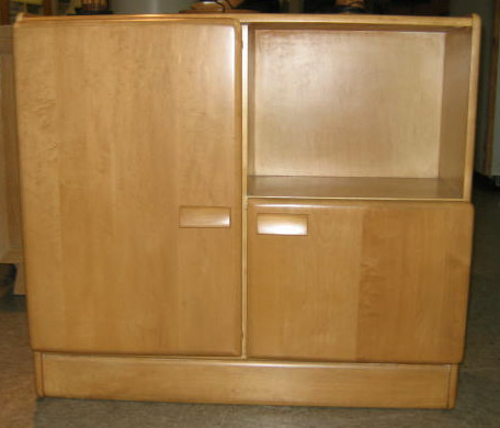 Appraisal: HEYWOOD WAKEFIELD Blond wood two door cabinet h w Estimate