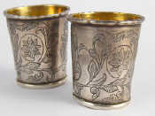 Appraisal: A pair of Russian silver vodka tots the bases with