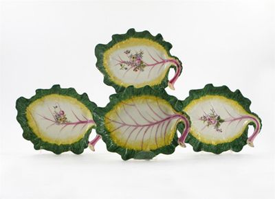 Appraisal: Four Chelsea cabbage leaf dishes three painted with a spray