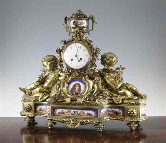 Appraisal: A th century French ormolu and porcelain mantel clock surmounted