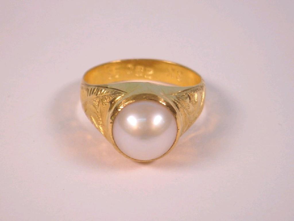 Appraisal: A single pearl set Asian style ring stamped C g