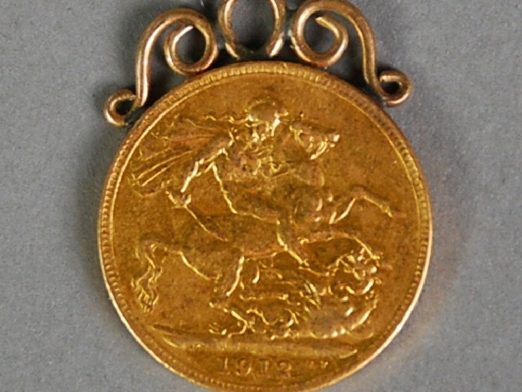 Appraisal: GEORGE V GOLD SOVEREIGN with soldered wirework mount as a