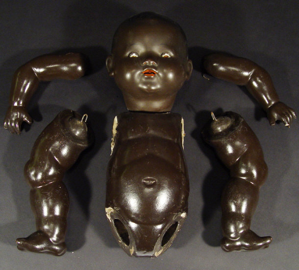 Appraisal: Black child's composite doll with jointed body the head with