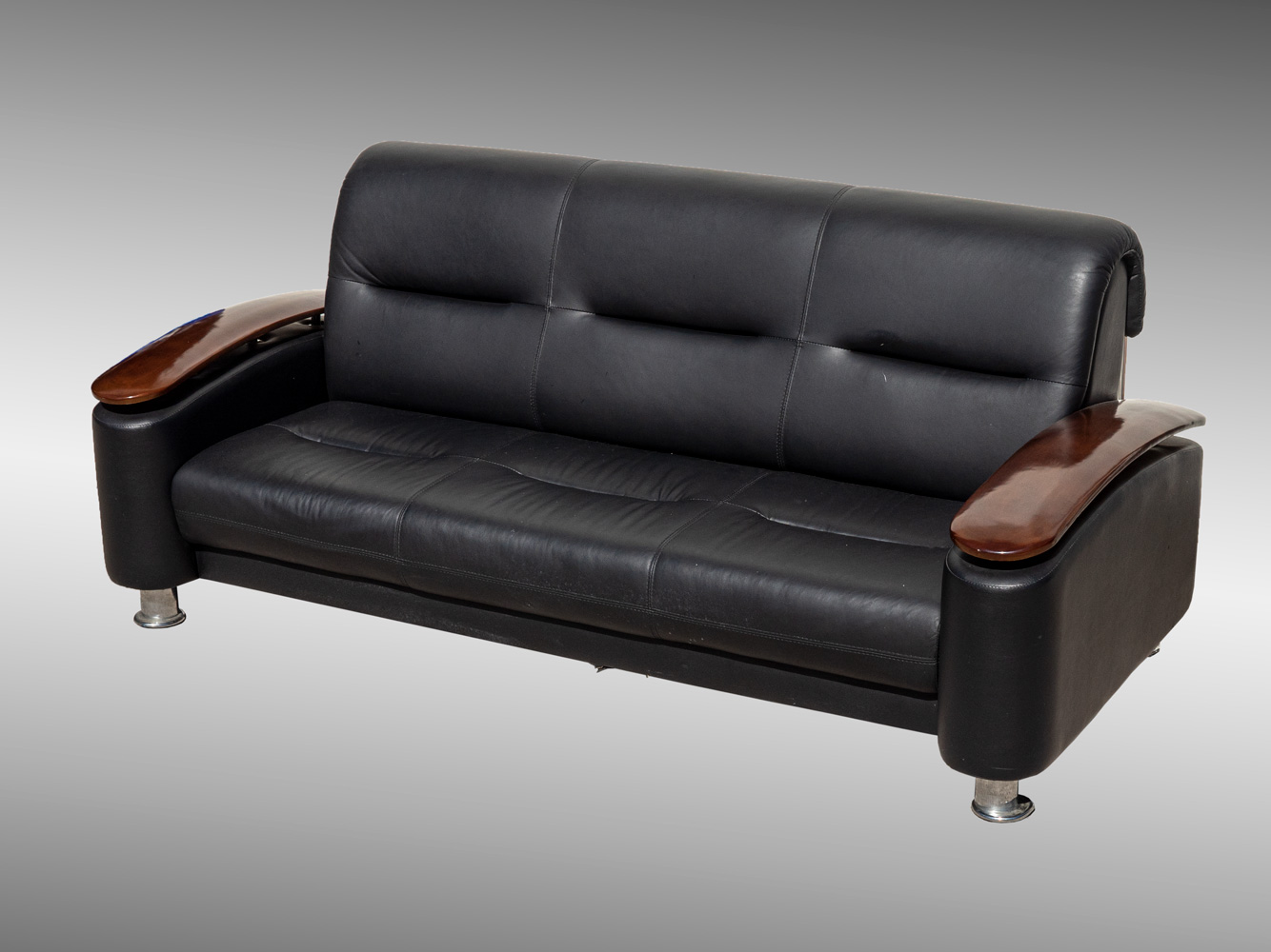 Appraisal: MODERN LEATHER SOFA Black leather sofa having wood armrests Once