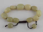 Appraisal: A string of jade beads largest bead approx x mm