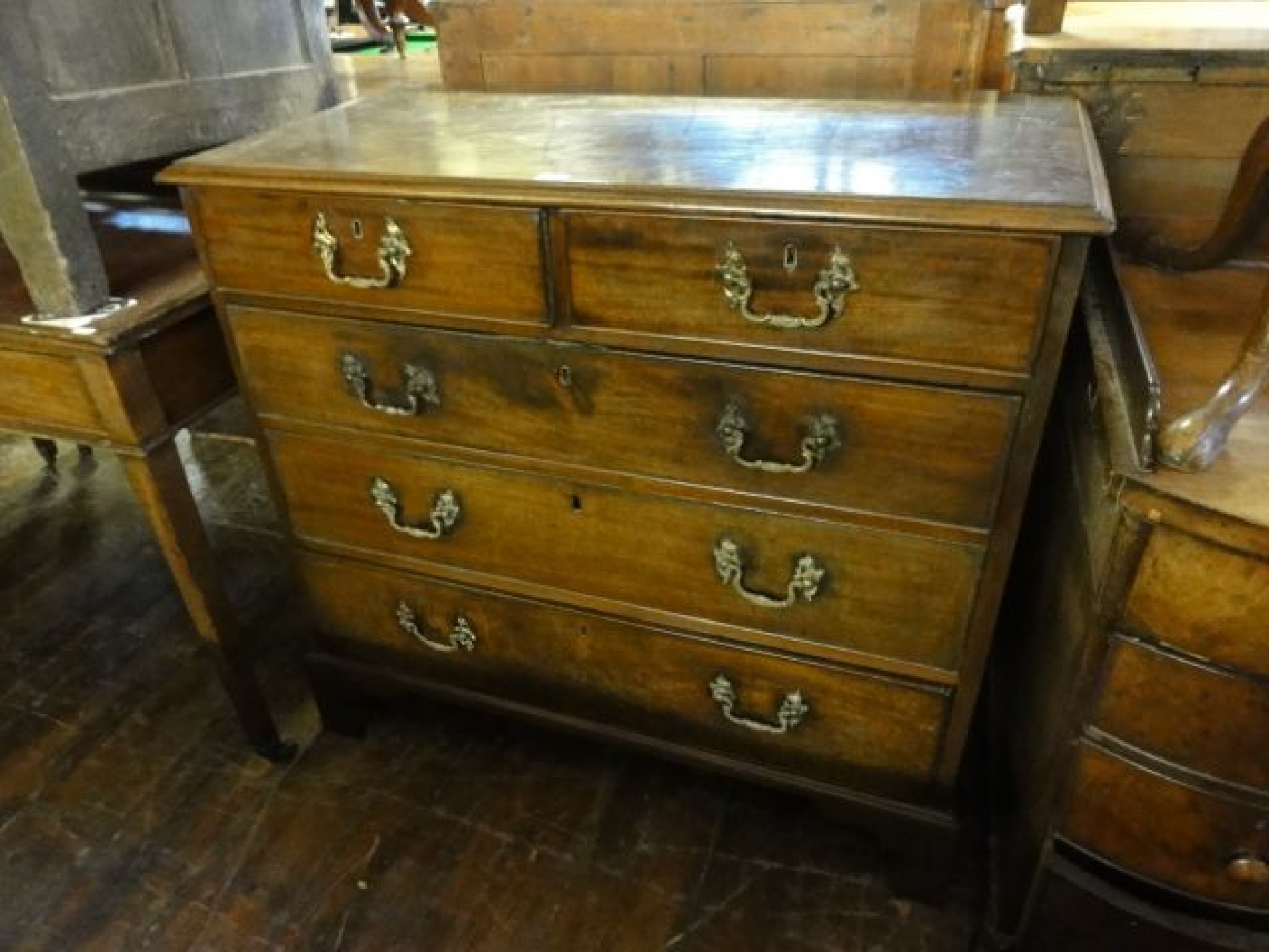 Appraisal: A Georgian mahogany chest of three long and two short