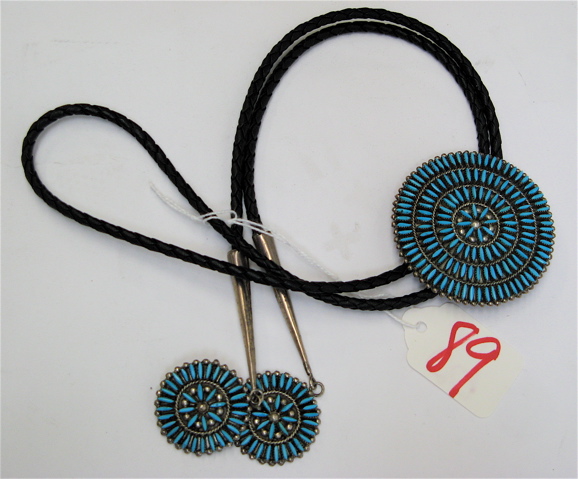 Appraisal: ZUNI STERLING TURQUOISE BOLO TIE with circular needlepoint Turquoise settings