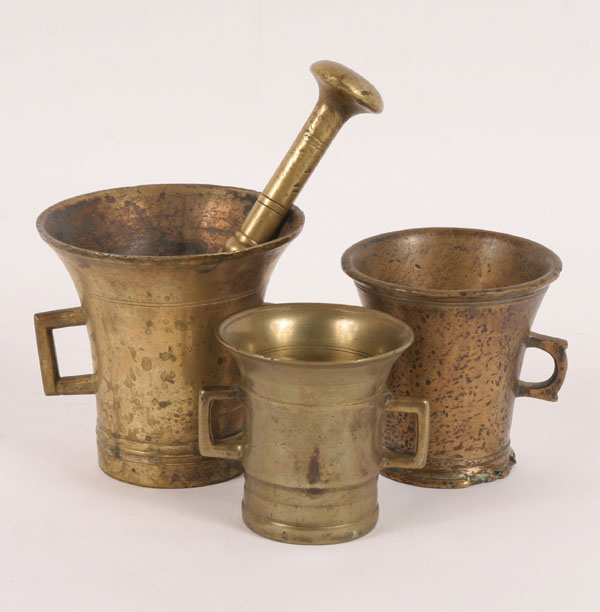 Appraisal: Early brass double handle mortars pc with one pestle Tallest