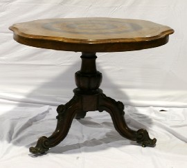 Appraisal: A Victorian tilt top loo table in walnut marquetry on