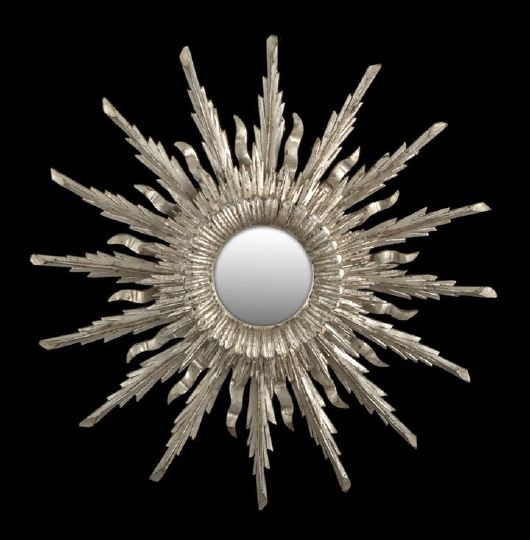 Appraisal: Italian Carved and Silvered Wood Sunburst Looking Glass in the