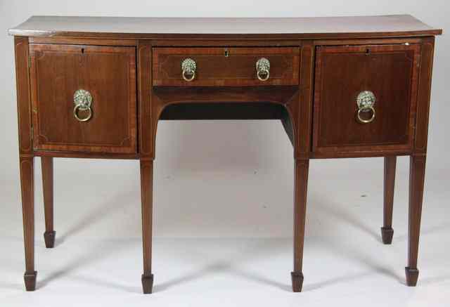 Appraisal: A George III style bow-fronted sideboard with cross-banded top and