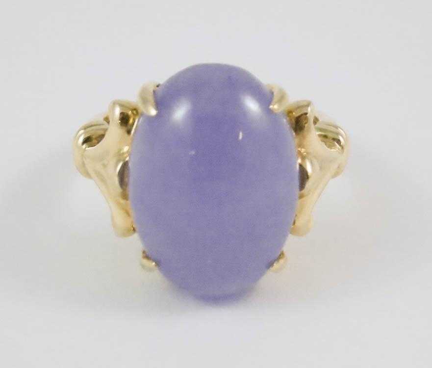 Appraisal: LAVENDER JADE AND FOURTEEN KARAT GOLD RING set with an