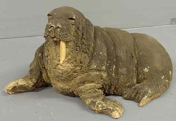 Appraisal: Cast plaster walrus garden ornament with one ivory tusk h