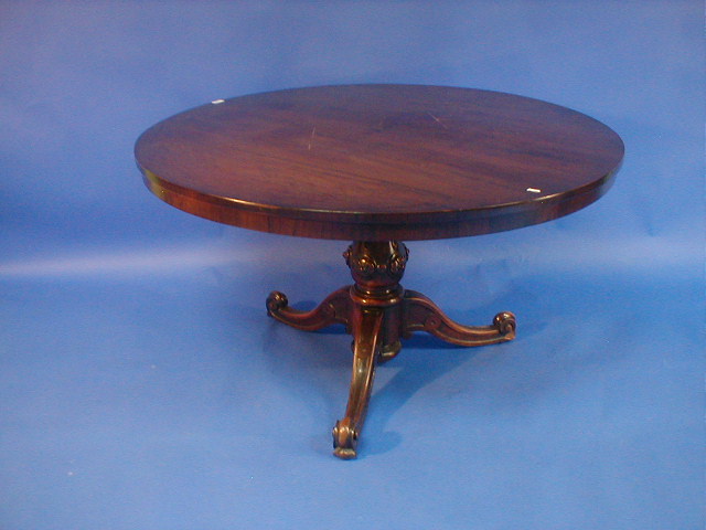 Appraisal: A Victorian walnut breakfast table with circular tilt top carved