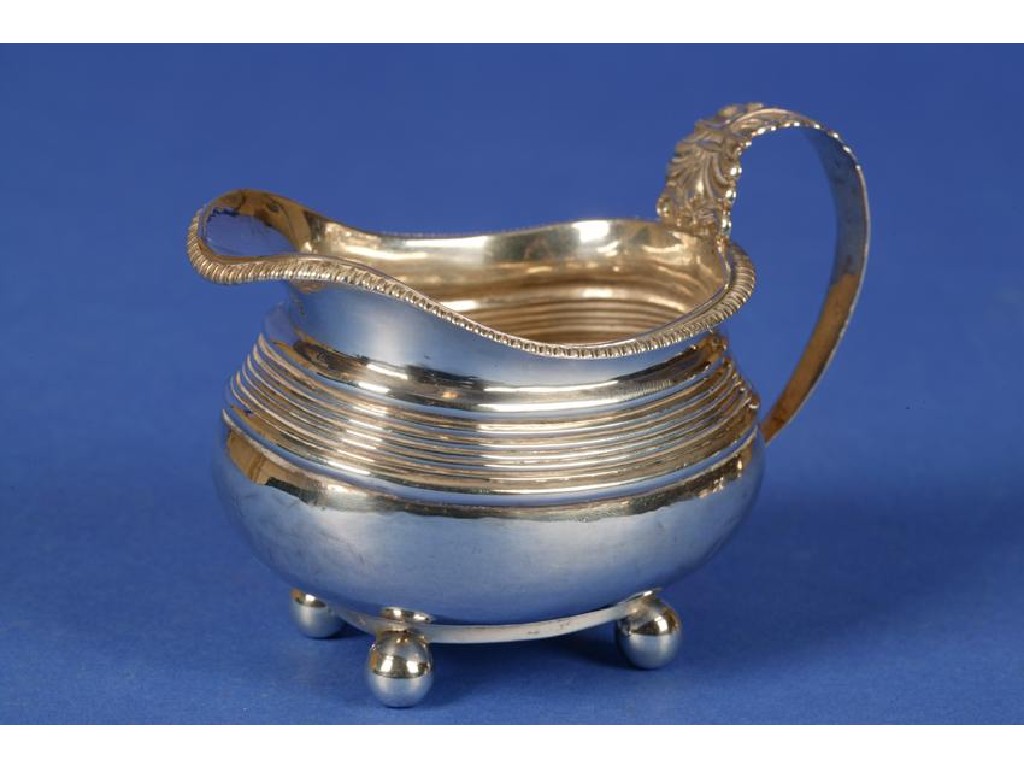 Appraisal: A GEORGE III SILVER CREAM JUG of bellied form with