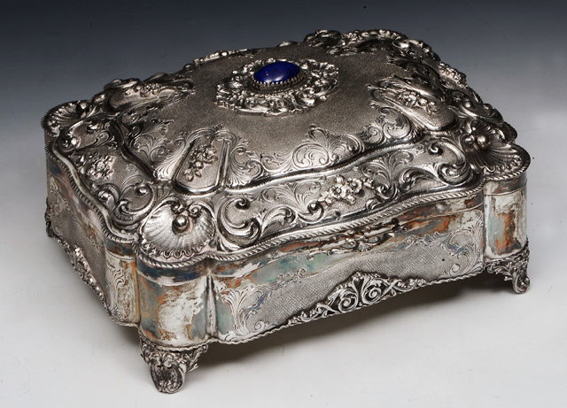 Appraisal: A CONTINENTAL GRADE SILVER BOX with shaped sides and with