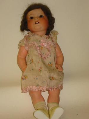 Appraisal: An Armand Marseille bisque head girl doll with brown glass