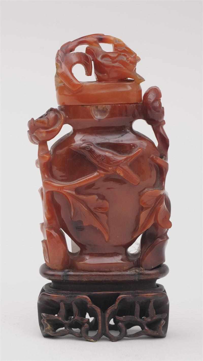 Appraisal: CHINESE CARVED AGATE SNUFF BOTTLE The vase-form body and lid