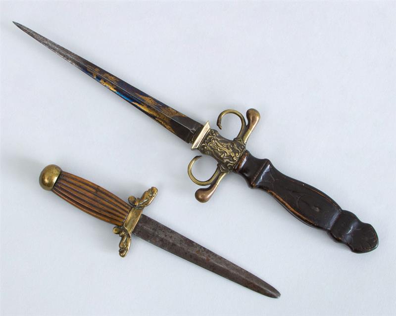 Appraisal: TWO DECORATIVE BRASS-MOUNTED WOOD AND METAL DAGGERS One with a