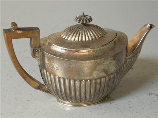 Appraisal: Victorian oval silver teapot with half gadrooned body and cover