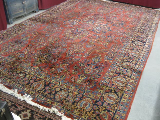 Appraisal: Sarouk Semi-Antique Persian HandmadeRoom Size Rug elaborate florals salmon field