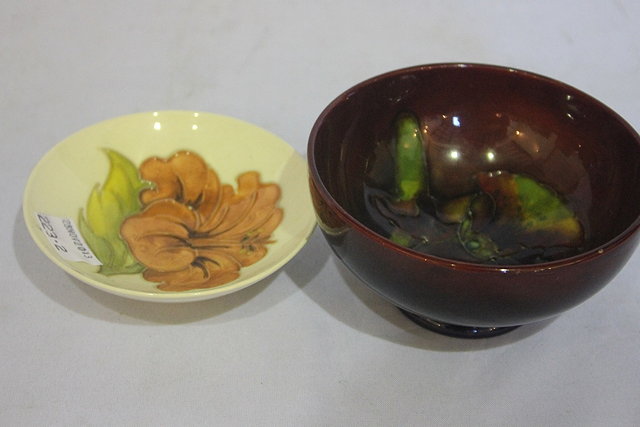 Appraisal: A MOORCROFT ORCHID PATTERN BOWL in flambe colourway impressed Moorcroft