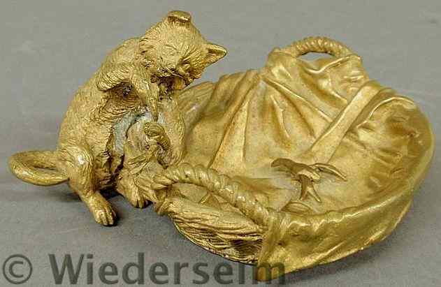 Appraisal: Bronze figural group of a cat and a basket of