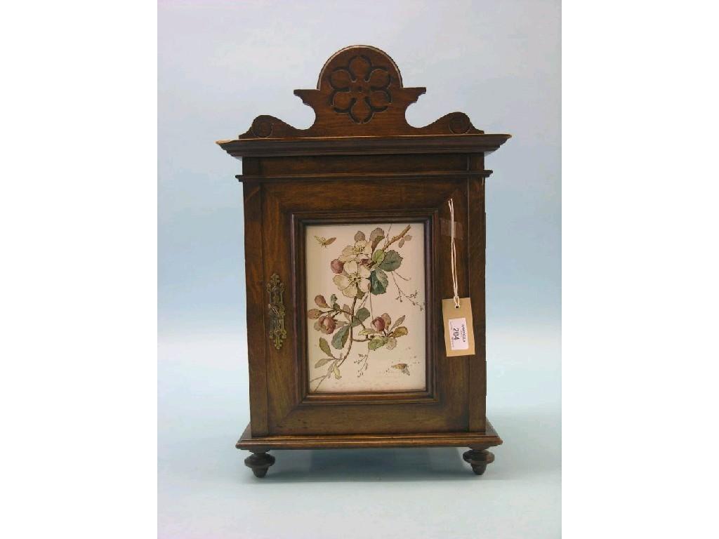 Appraisal: A Victorian beech table-top cabinet single door inset with printed