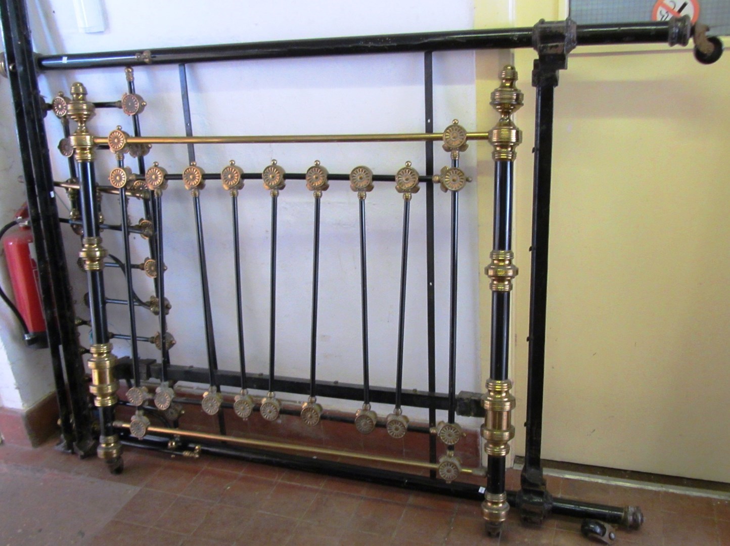 Appraisal: A late Victorian black painted brass mounted double bed cm