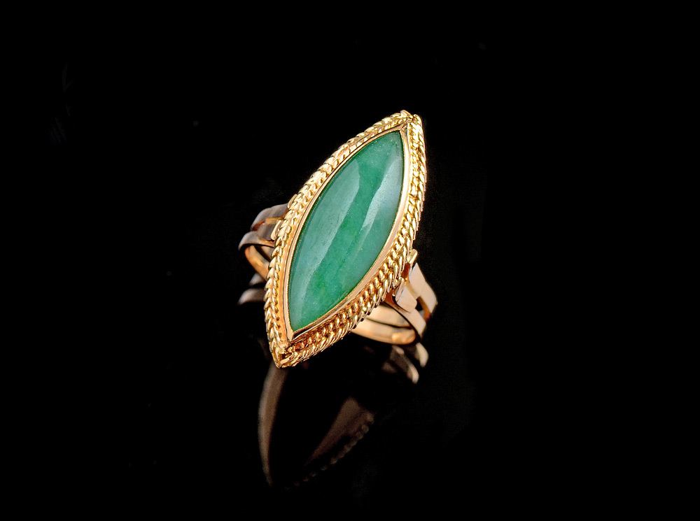 Appraisal: ART DECO JADEITE RING K yellow gold ring centering a