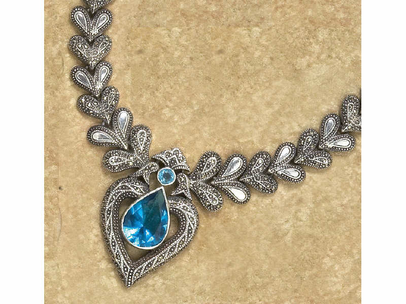 Appraisal: SILVER MARCASITE PENDANT Heavy silver necklace with blue faceted stone